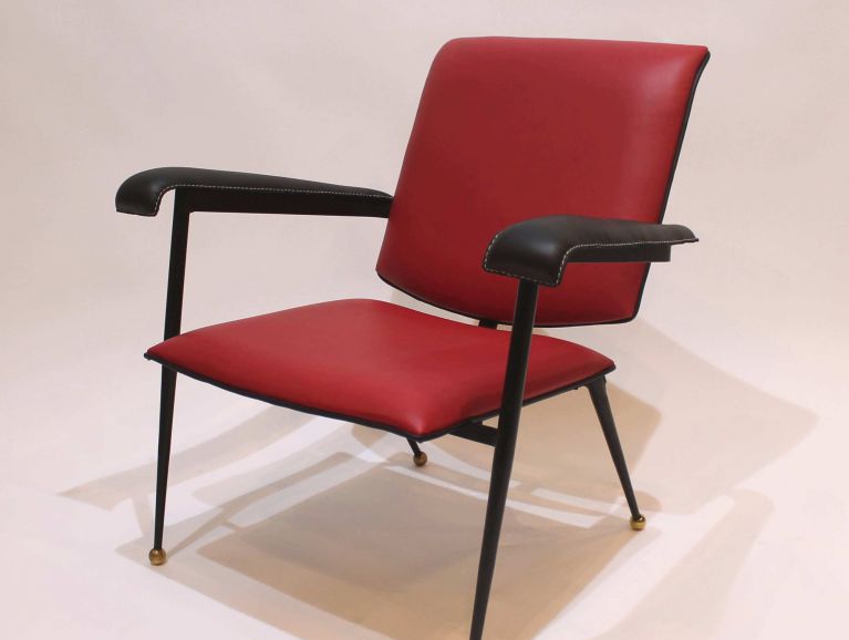 Complete restoration of an armchair by designer Jacques Adnet, reupholstered in leather from Tassin